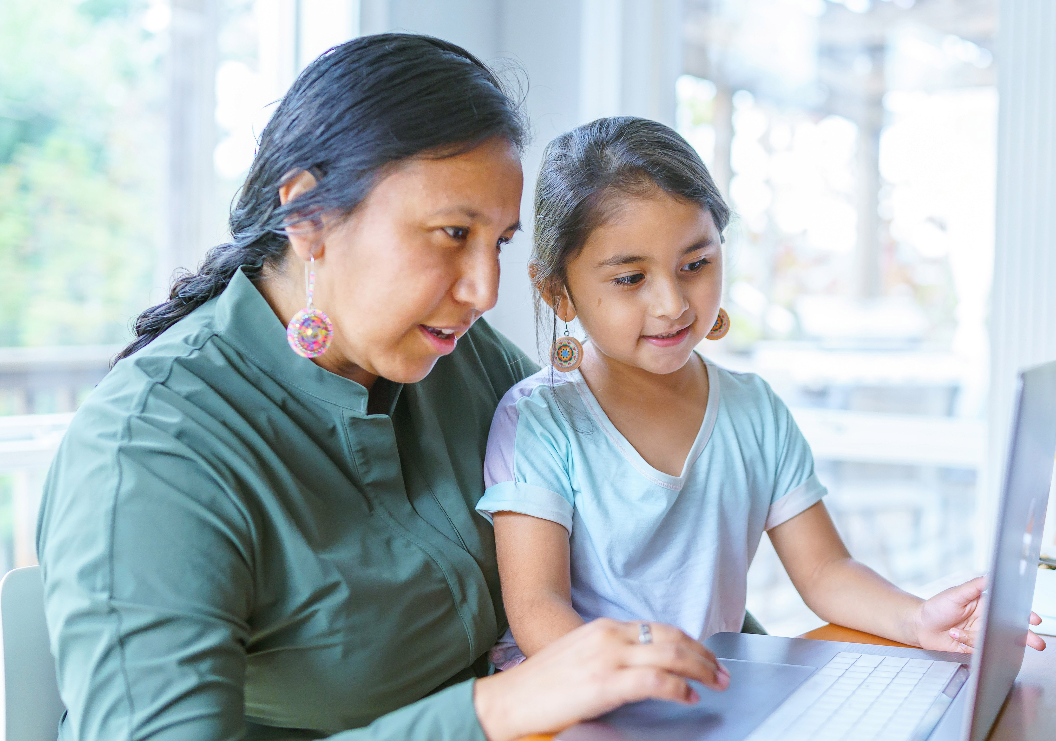 Woman and child at computer