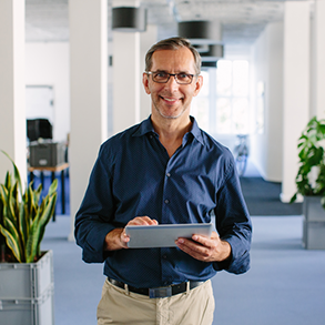 cleaning manager holding tablet