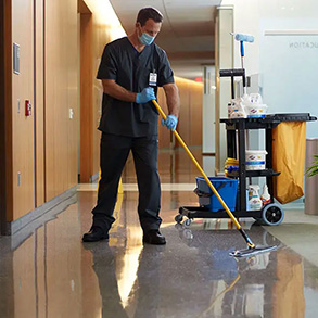 cleaning professional mopping floor