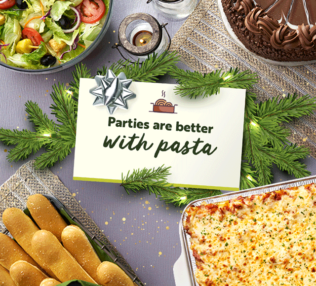 Olive Garden holiday catering spread with classic Italian dishes.