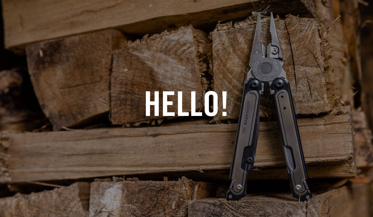 ARC multi-tool next to stack of wood