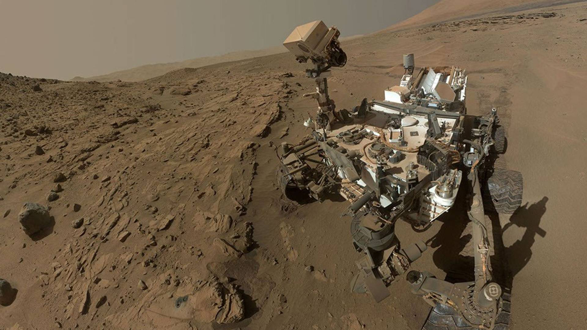 Curiosity rover on Mars capturing the rocky Martian landscape.