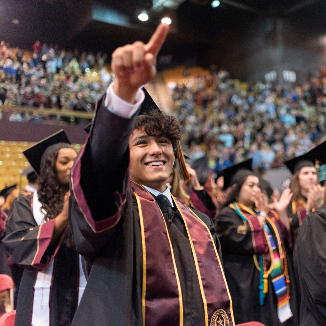 TXST student at graduation ceremony