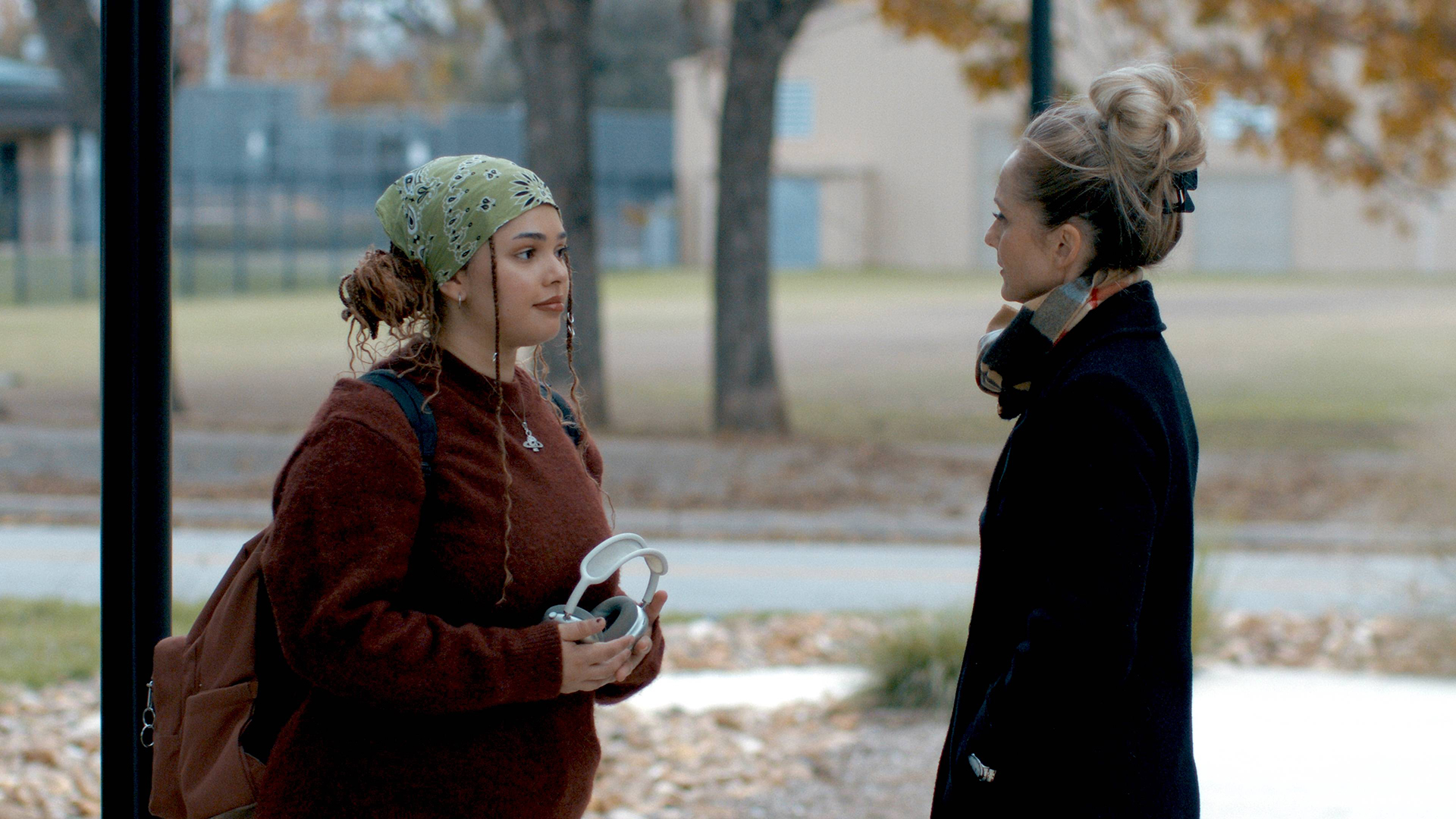 Two people facing each other during filming "Leads" at Texas State University