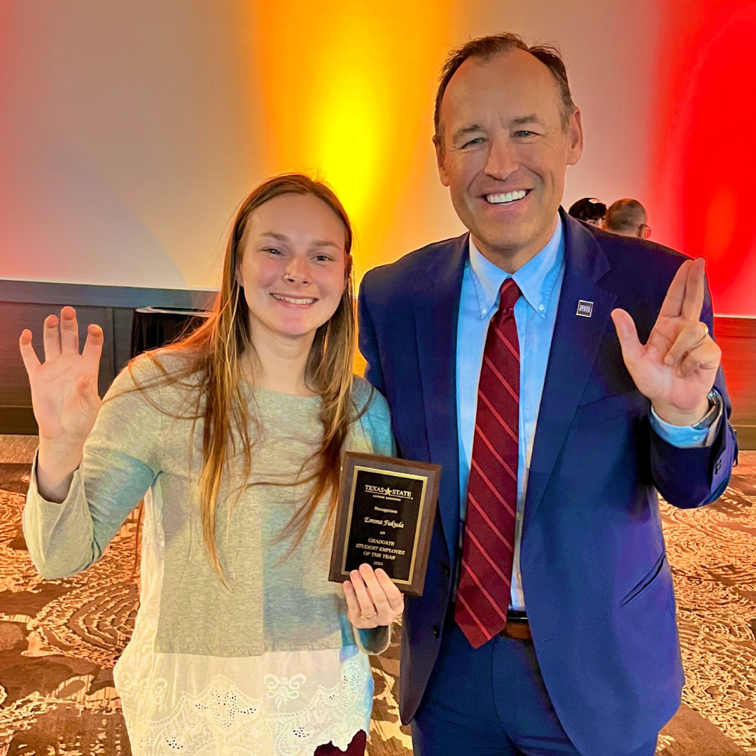 TXST student at awards banquet with President Damphousse