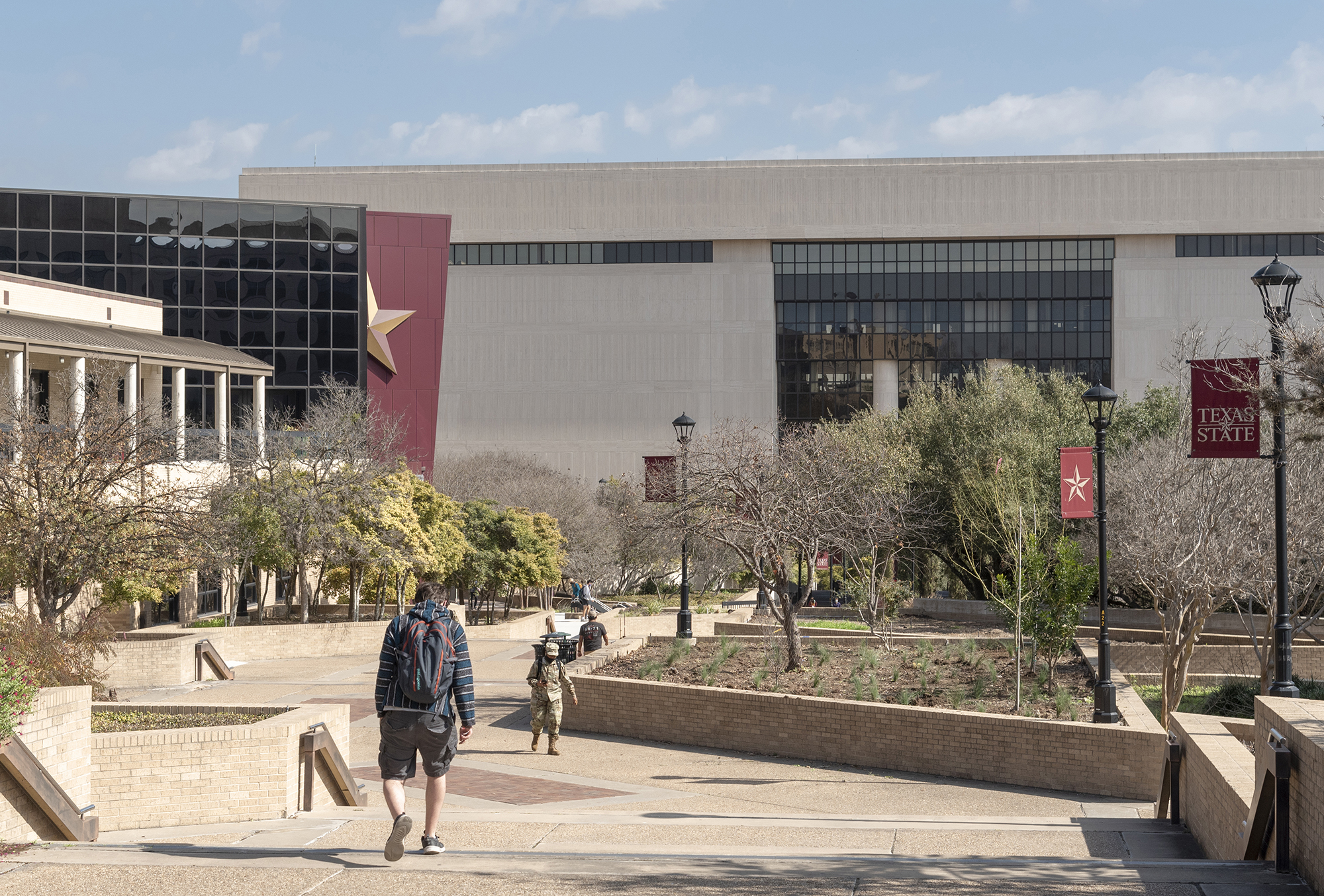 students walking on txst san marcos campus