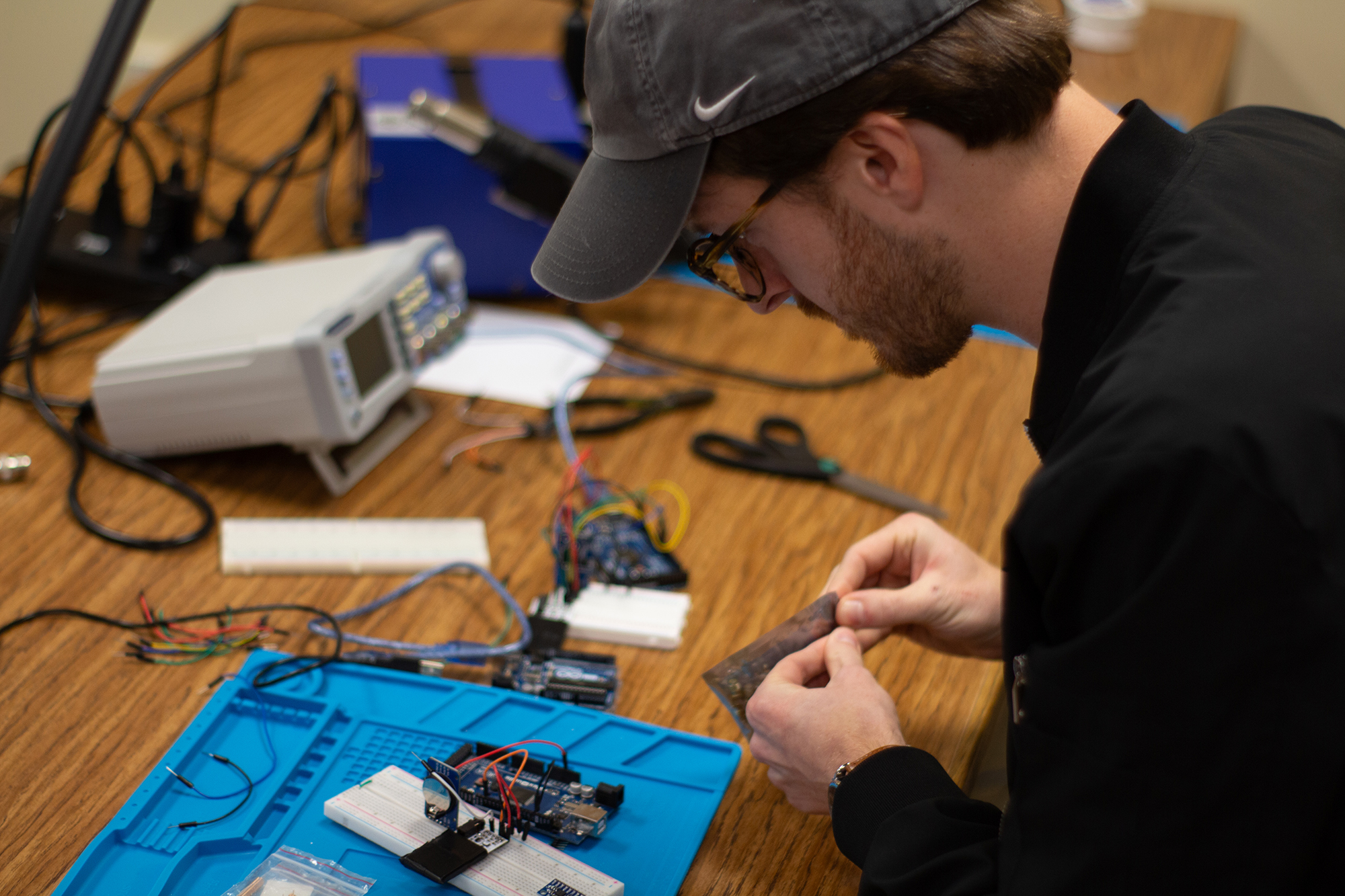 astronomy researcher assembling electrical components