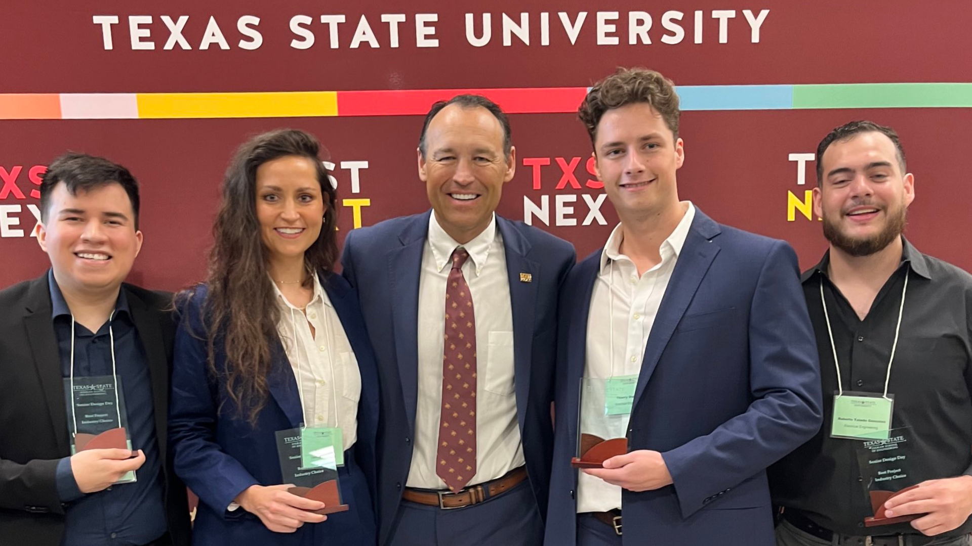 TXST students at senior design day with President Kelly Damphousse