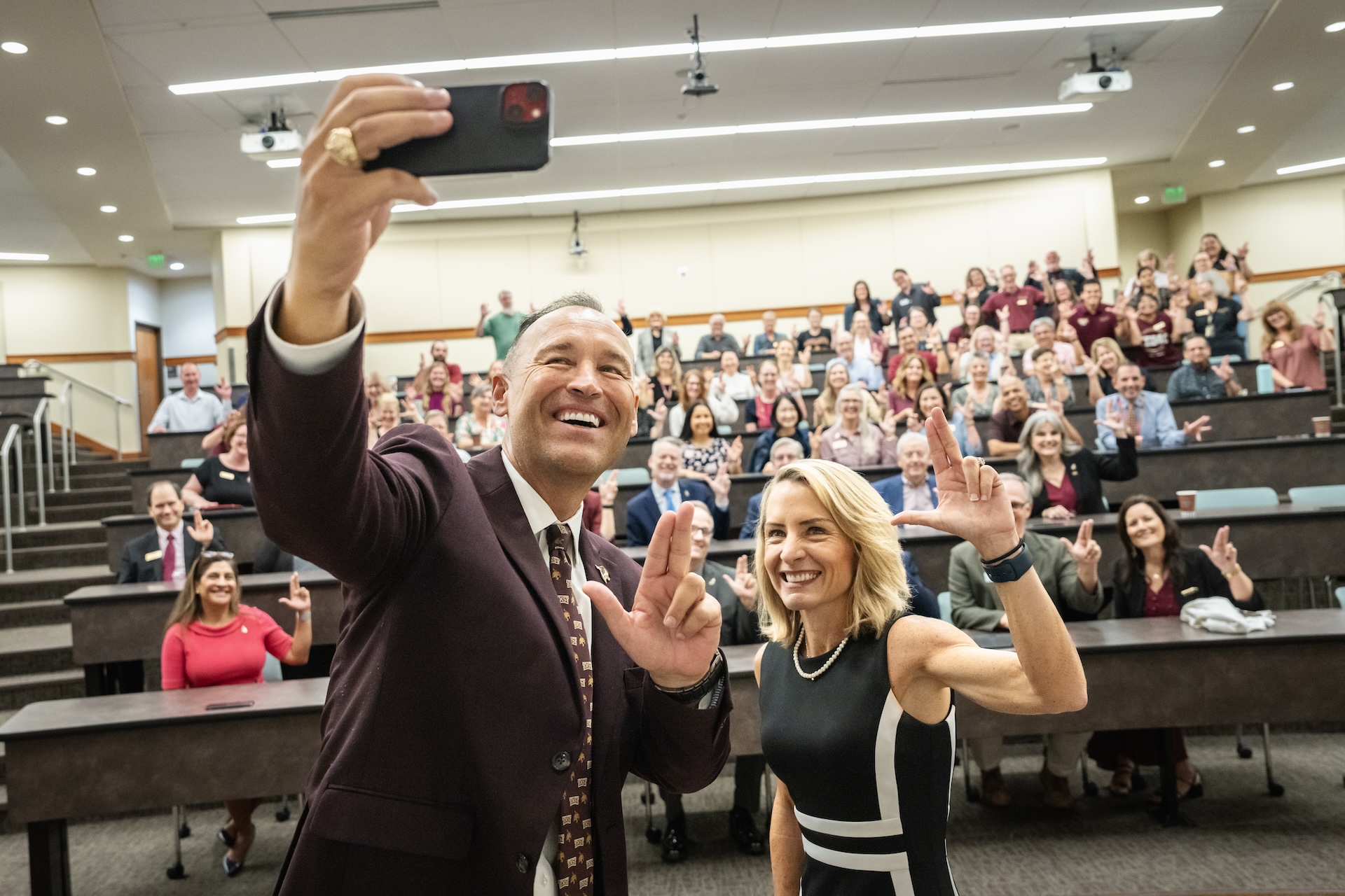 Texas State University President Kelly Damphousse with Dr. Julie Lessiter and faculty at the Round Rock Campus