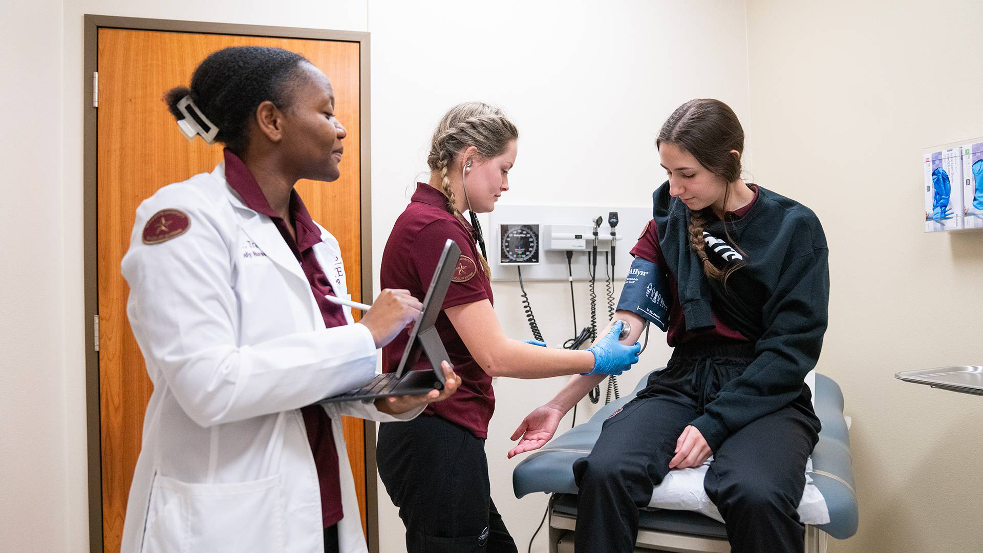 Three students in a medical office