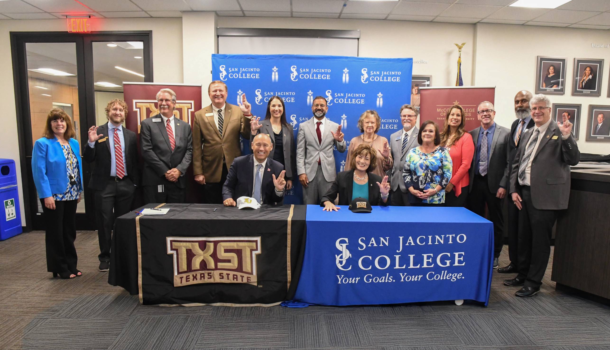 TXST and San Jacinto College leadership pose for a photo during partnership signing.