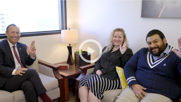 three people sitting in an office 