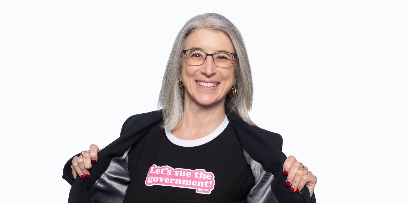 Cindy Cohn wearing a shirt that says Let's Sue the Government.