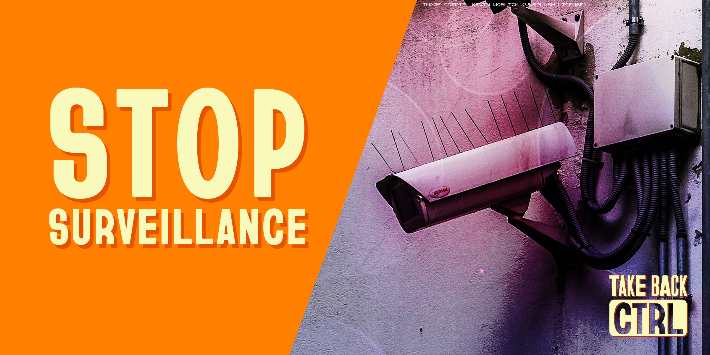 Orange banner that says "Stop Surveillance" next to a surveillance camera on an exterior wall.