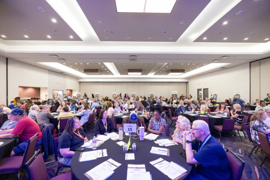 An image of a large gathering room filled with families who were present during the Self-Directed Services Family Meeting that took place on June 5th in Oklahoma City last year.