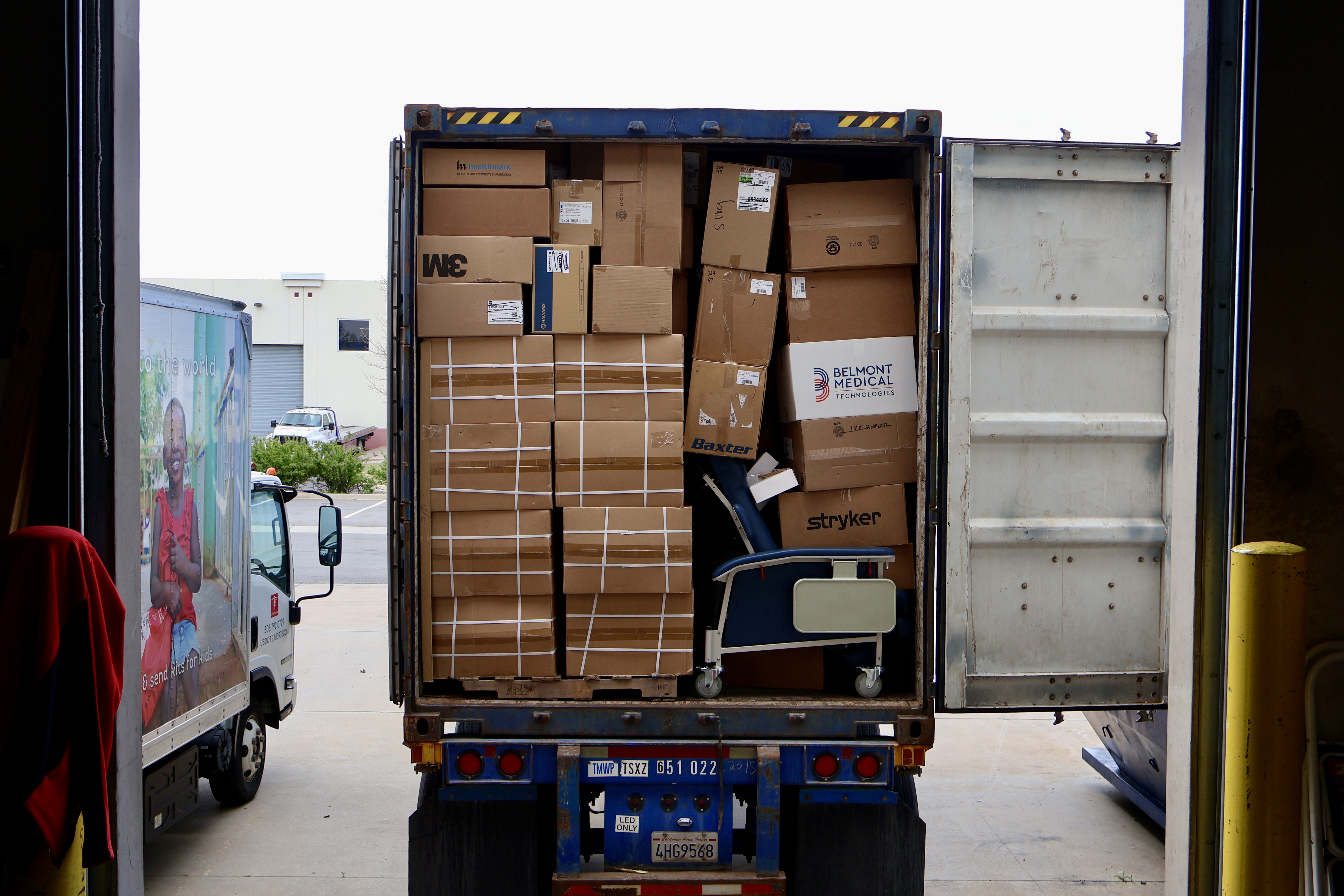 Boxes of donated medical equipment and supplies being loaded on a semi-truck leaving the Denver, Colorado warehouse. 