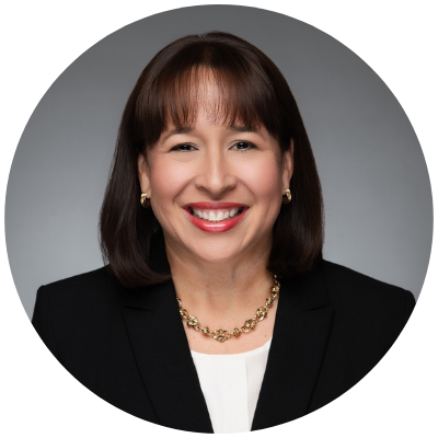 Photo of a smiling woman with shoulder length dark hair.