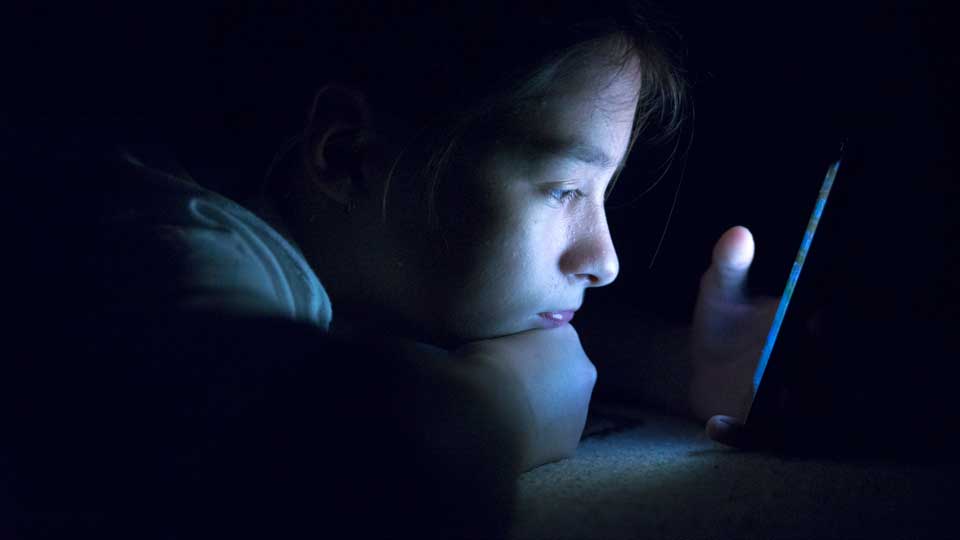 Teen on electronic device