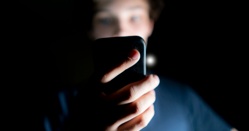 Young boy using mobile device