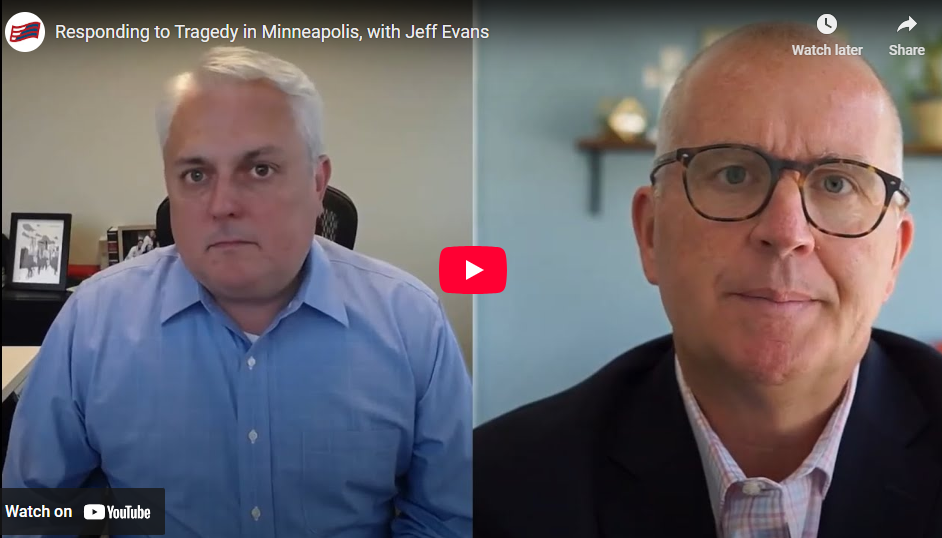 Jeff Evans on the left and Craig DeRoche on the right with the youtube play arrow between them