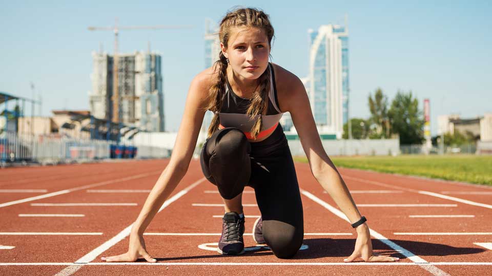 Young girl runner on track