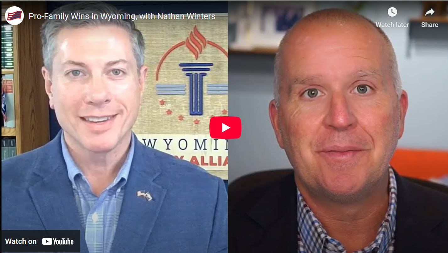 Nathan Winters and Craig DeRoche with the YouTube red and white play button in the middle of the photo