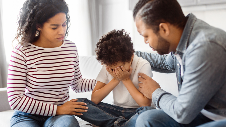 Family consoling young child