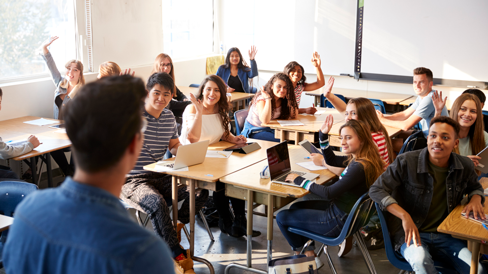 teacher in front of high school class